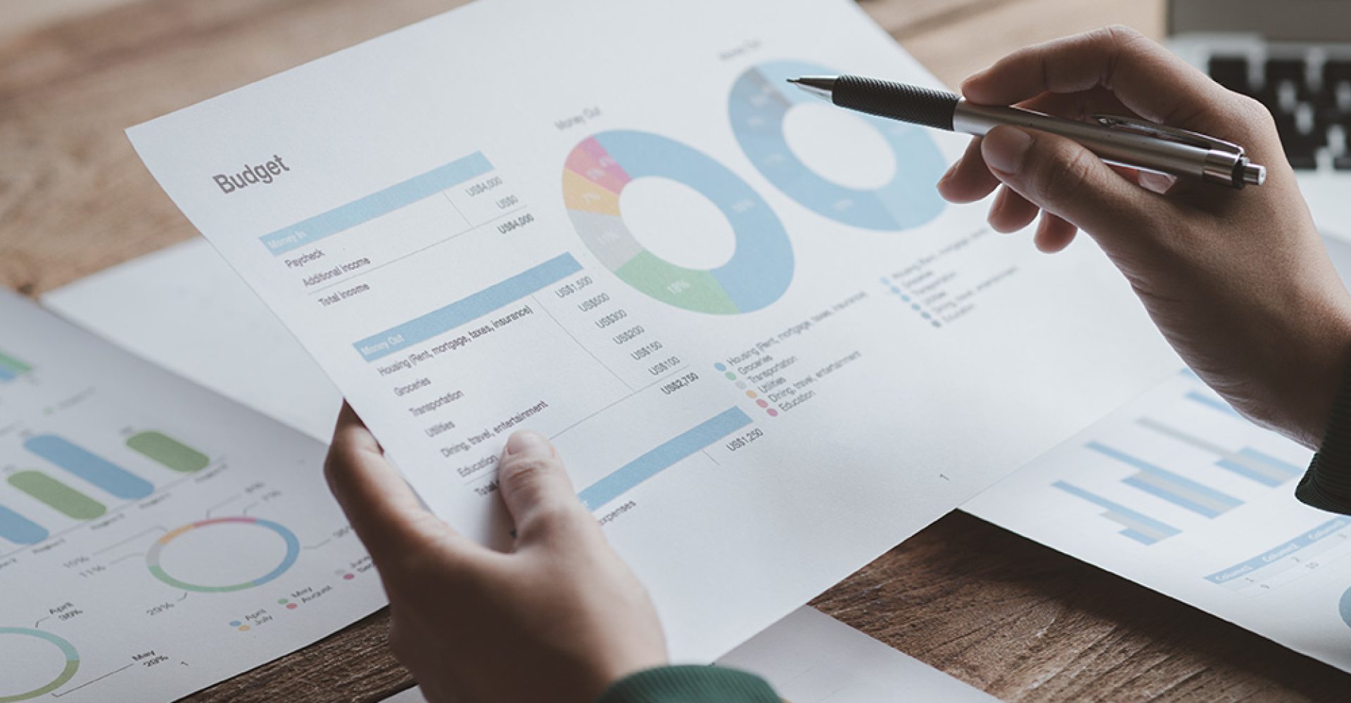 Business men are looking at the company's financial documents to analyze problems and find solutions before bringing the information to a meeting with a partner. Financial concept.